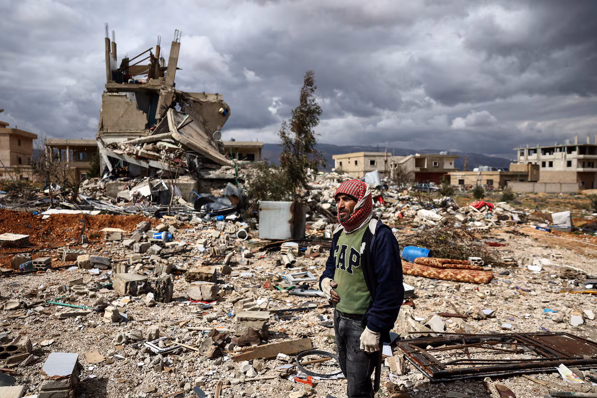 A man surveys the destruction in the Lebanese town of Chaat after an Israeli attack, March 23.